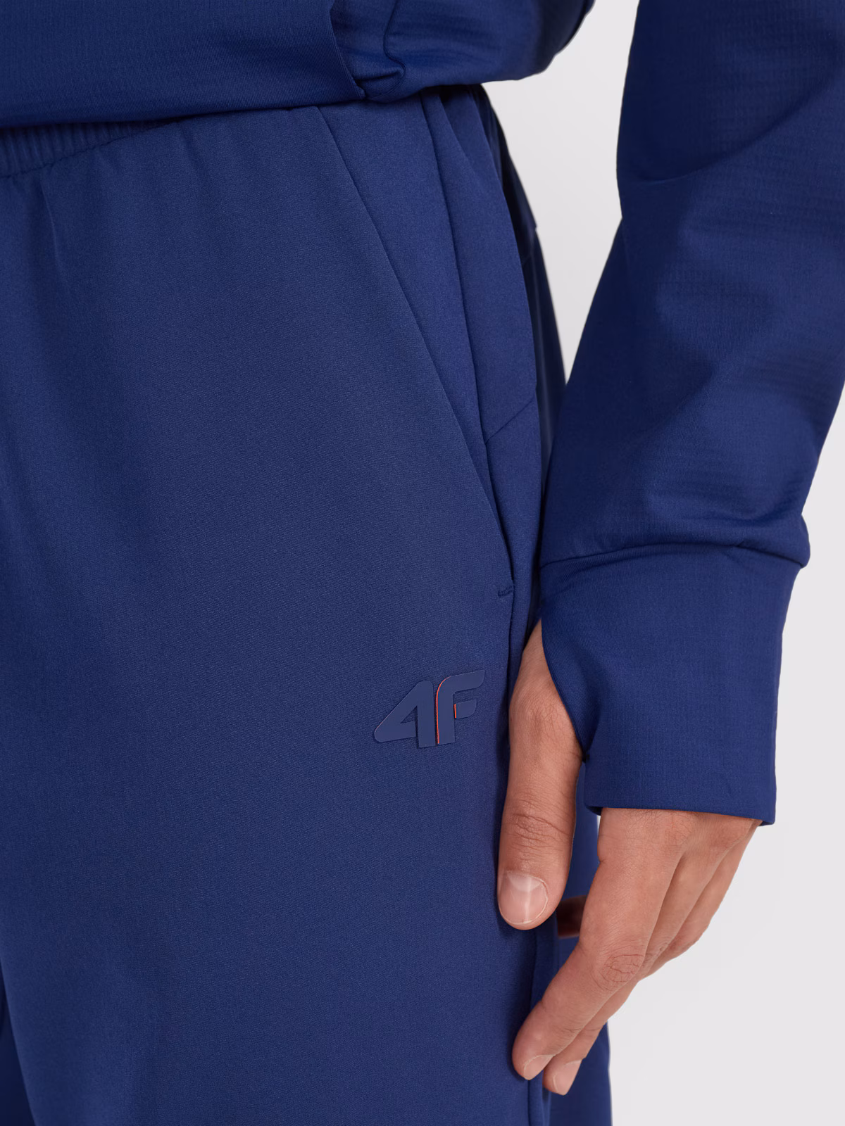 Spodnie treningowe szybkoschnące męskie 4F x Robert Lewandowski - granatowe