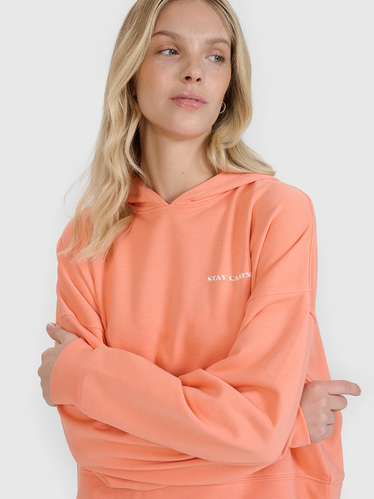 Bluza dresowa nierozpinana z kapturem damska - pomarańczowa