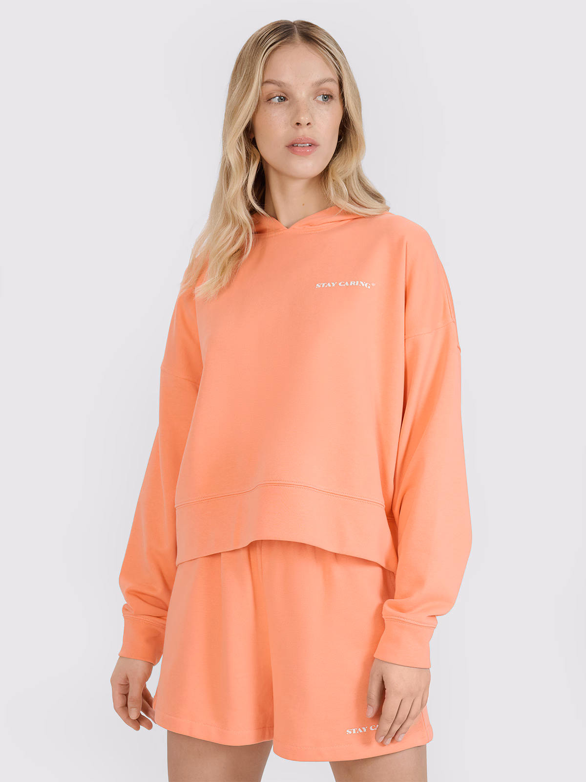 Bluza dresowa nierozpinana z kapturem damska - pomarańczowa