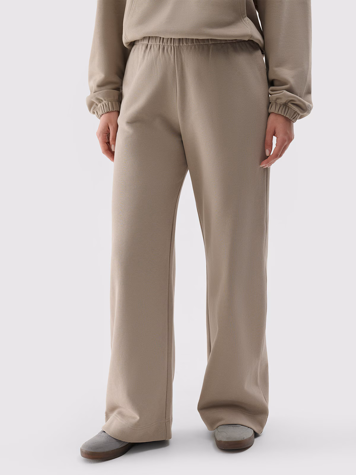 Spodnie dresowe z szerokimi nogawkami damskie - beżowe