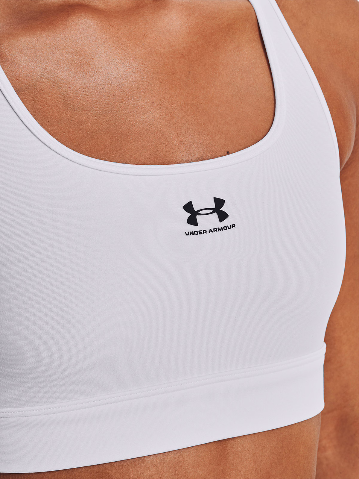 Biustonosz treningowy Under Armour UA HeatGear Mid Padless - biały