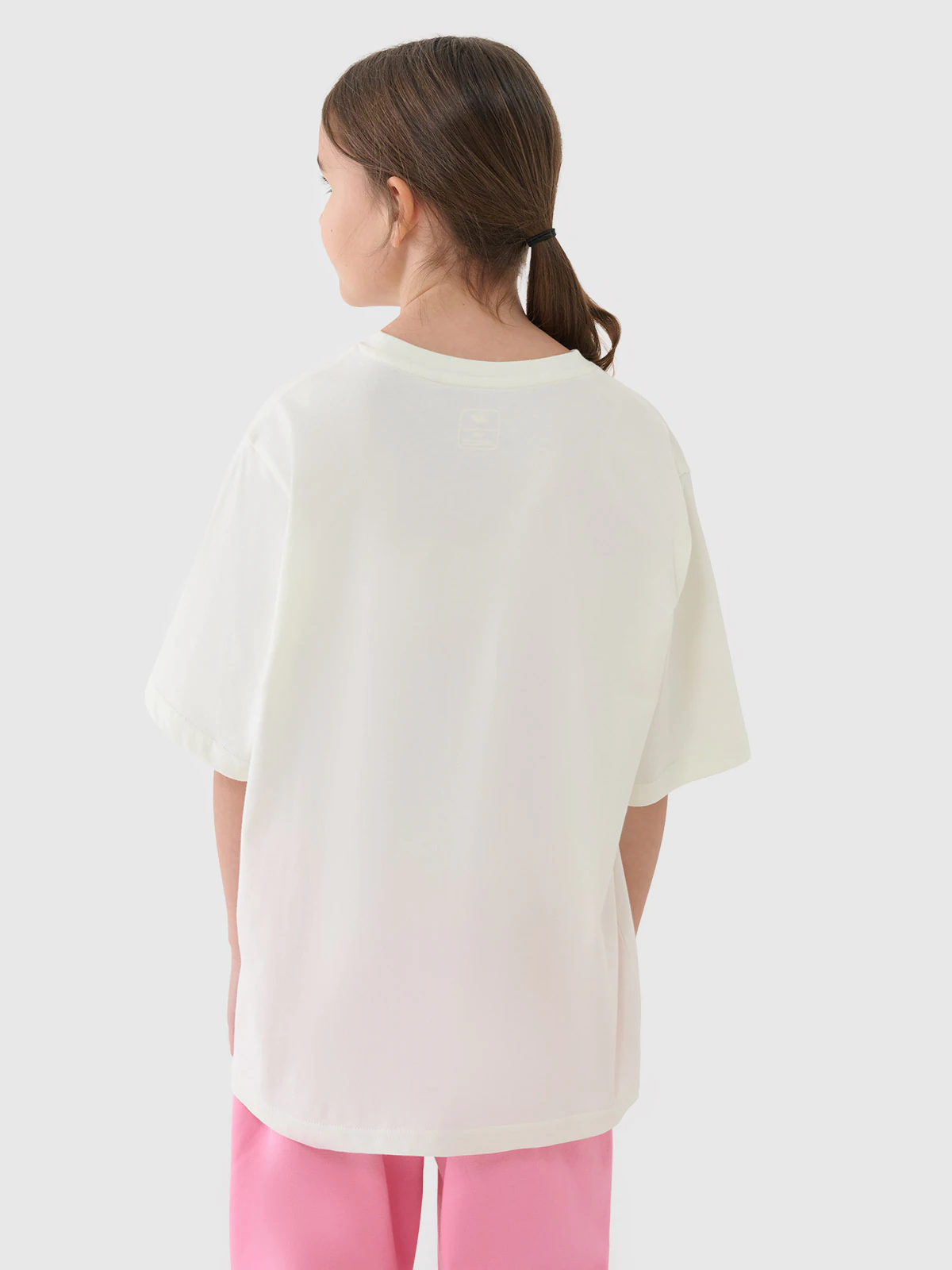 T-shirt oversize z nadrukiem dziewczęcy - różowy