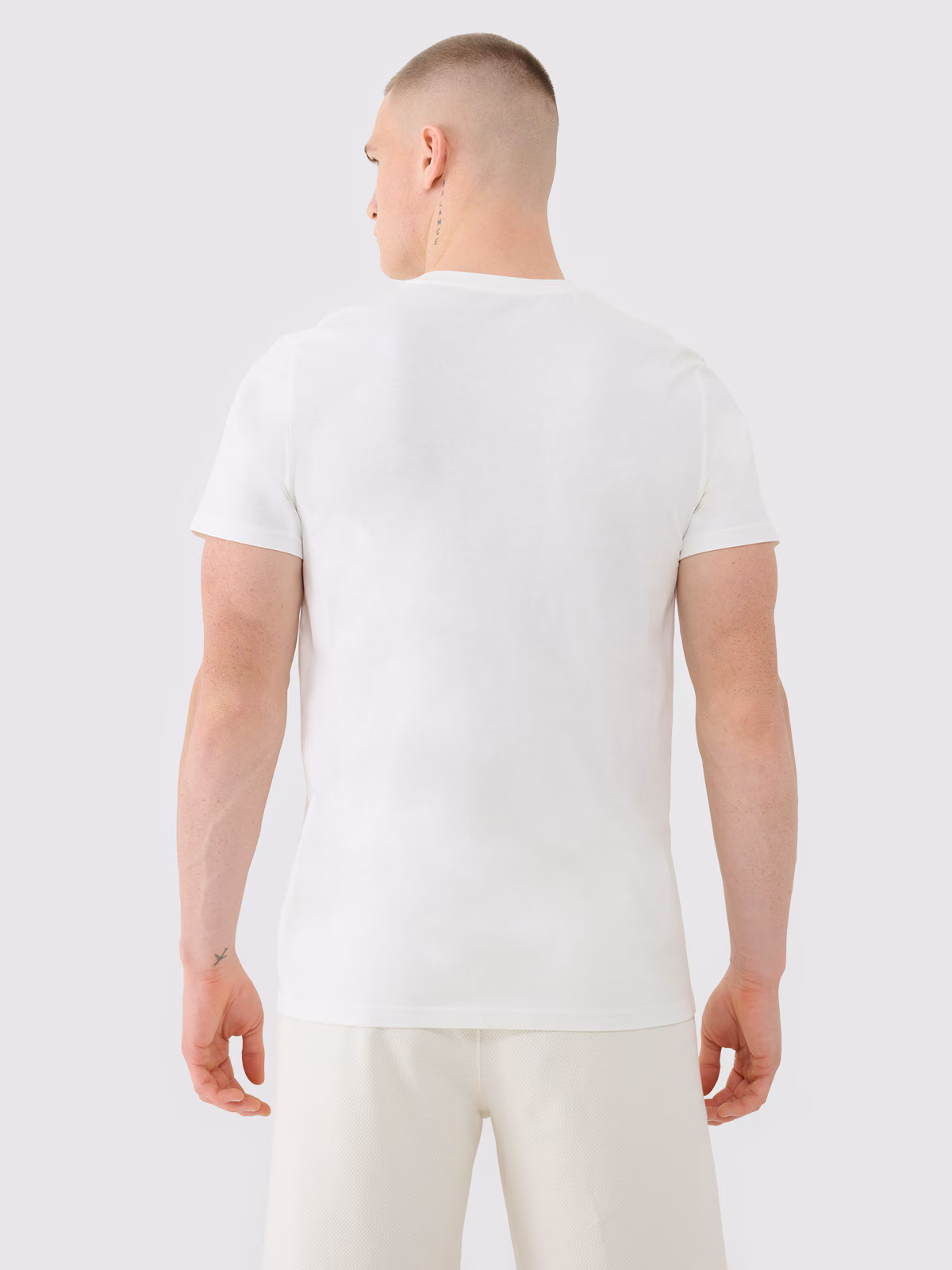 T-shirt regular z nadrukiem męski - beżowy