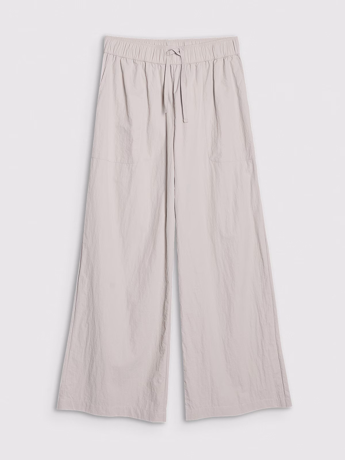 Spodnie casual z szerokimi nogawkami damskie - beżowe