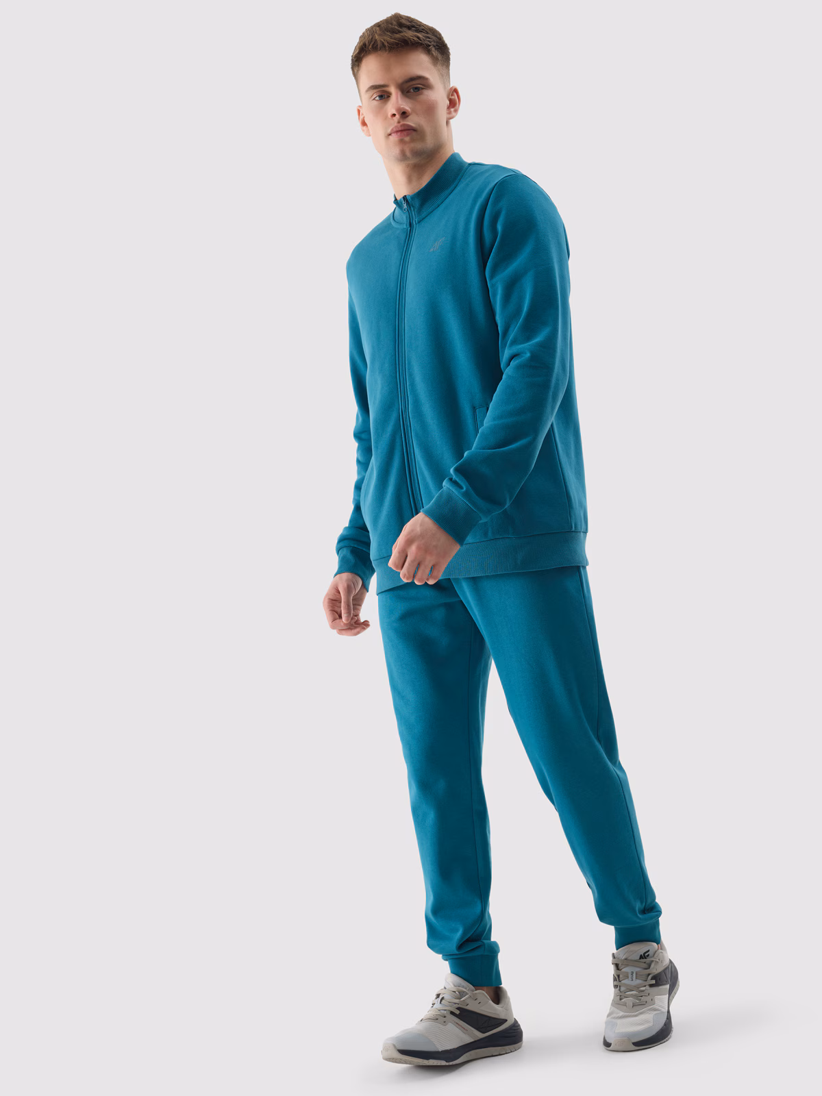 Bluza dresowa rozpinana bez kaptura męska - turkusowa