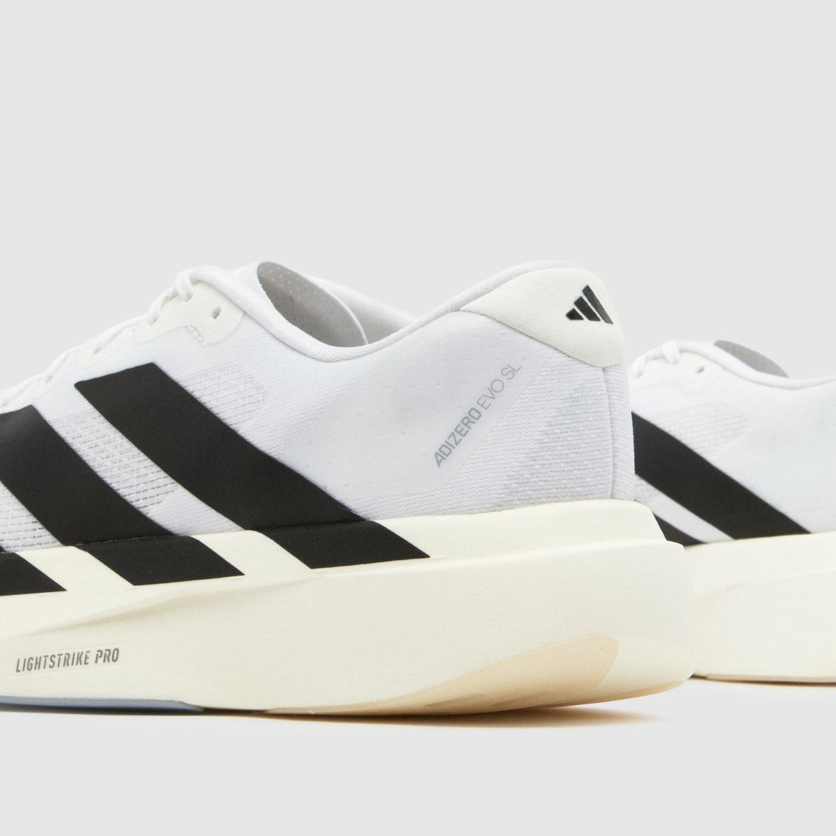adidas  Adizero Evo SL in White & Black adidas  Adizero Evo SL in White & Black