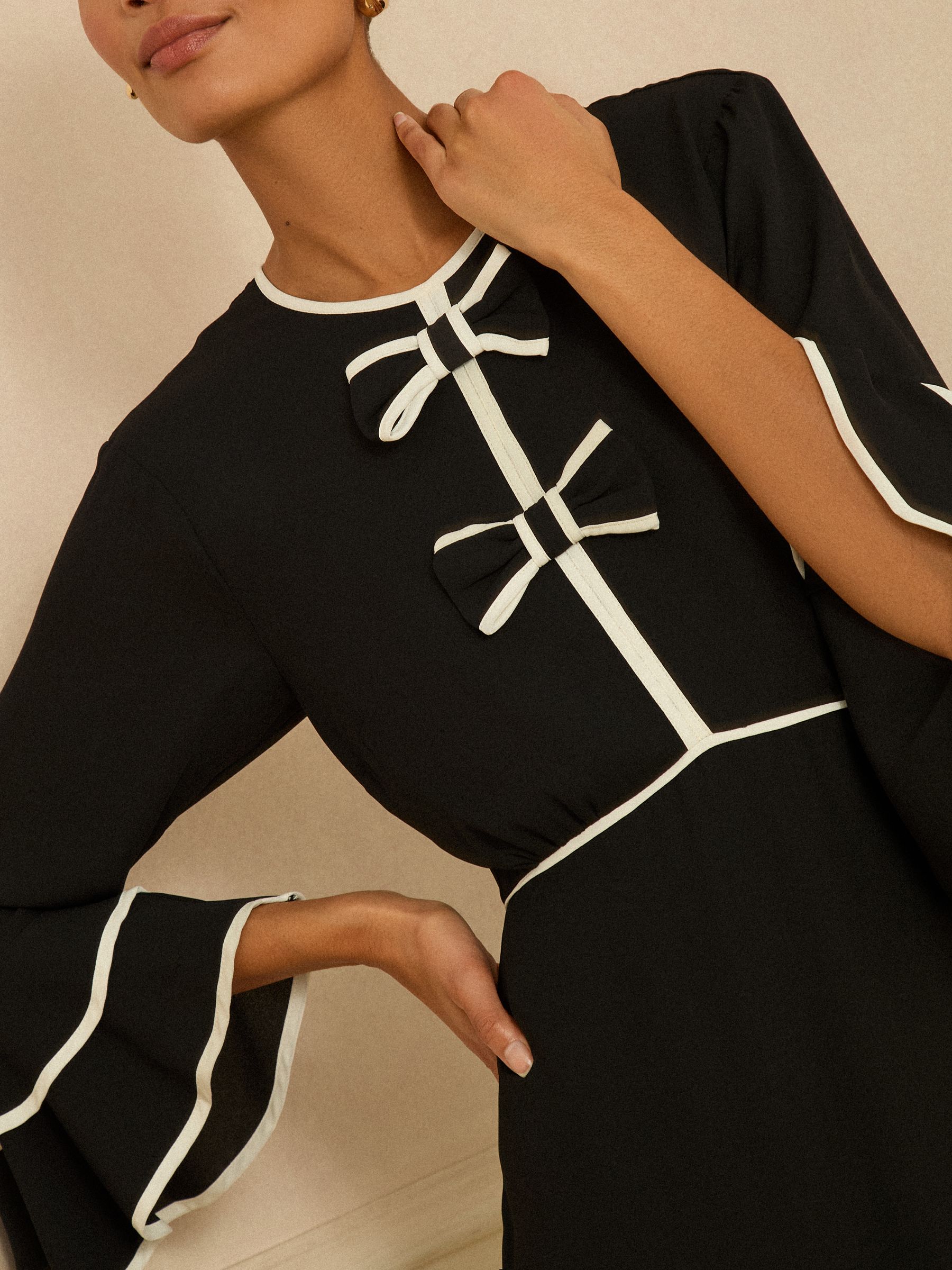 Love & Roses Bow Tipped Flute Sleeve Mini Dress